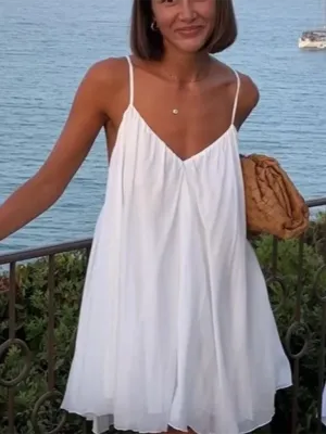 Backless Mini Dress with Pleated Hem and Spaghetti Straps