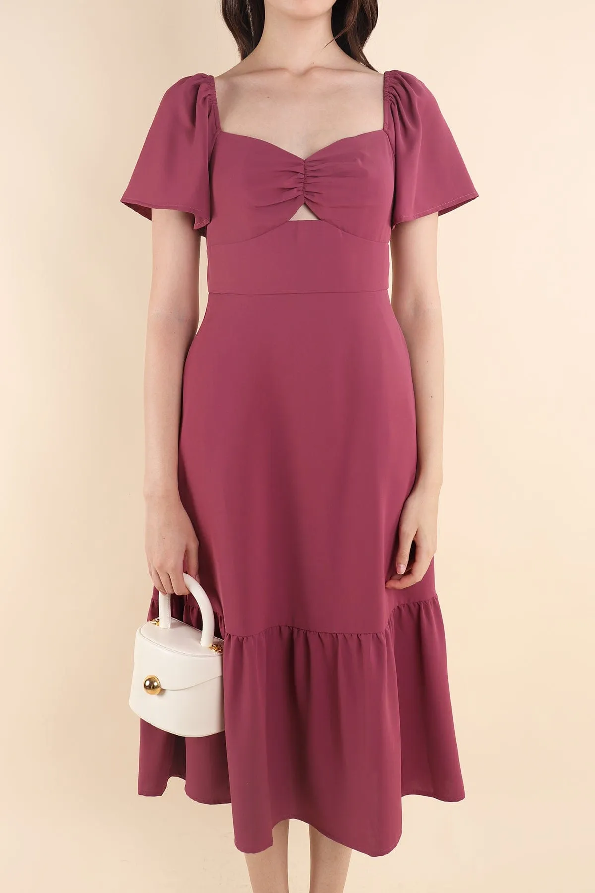 NATALY CUT-OUT MIDAXI DRESS IN MAGENTA